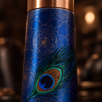 Peacock feather UV embossed design closeup on Tamrit copper bottle