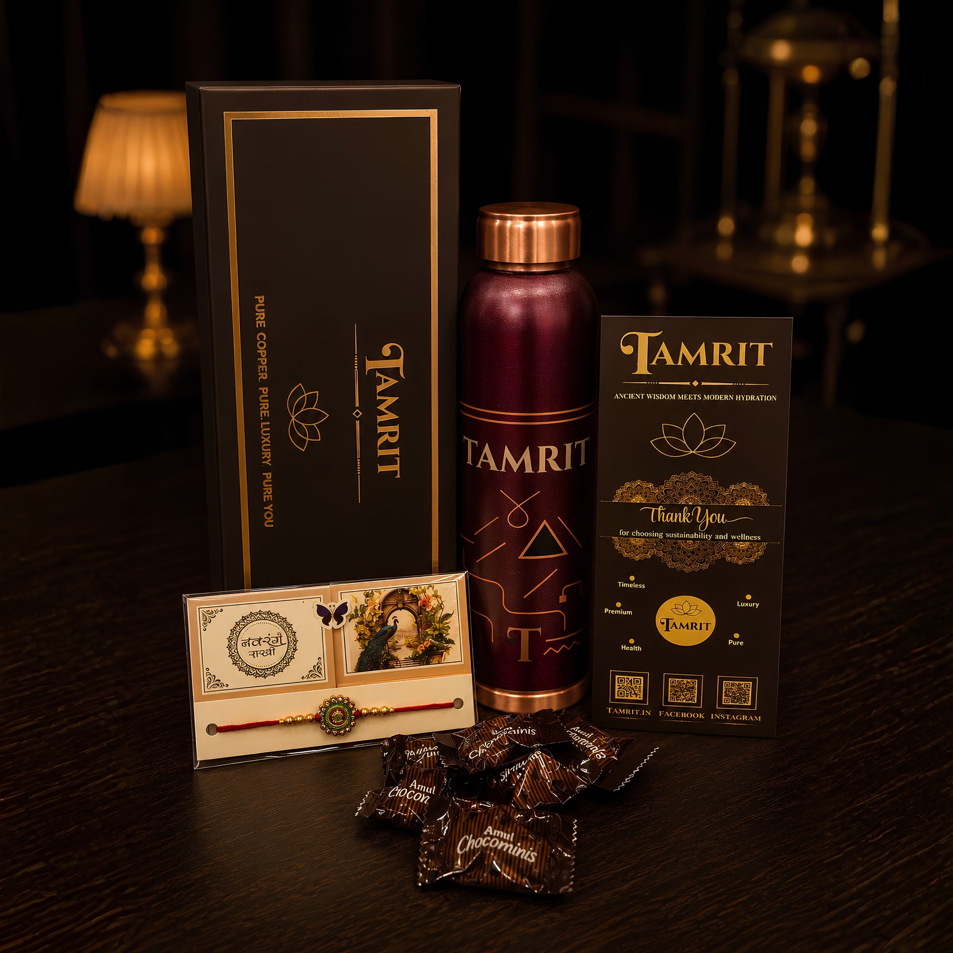 3. Pure copper water bottle rakhi gift set for brother with 1 Litre bottle, rakhi and chocolates on wooden table