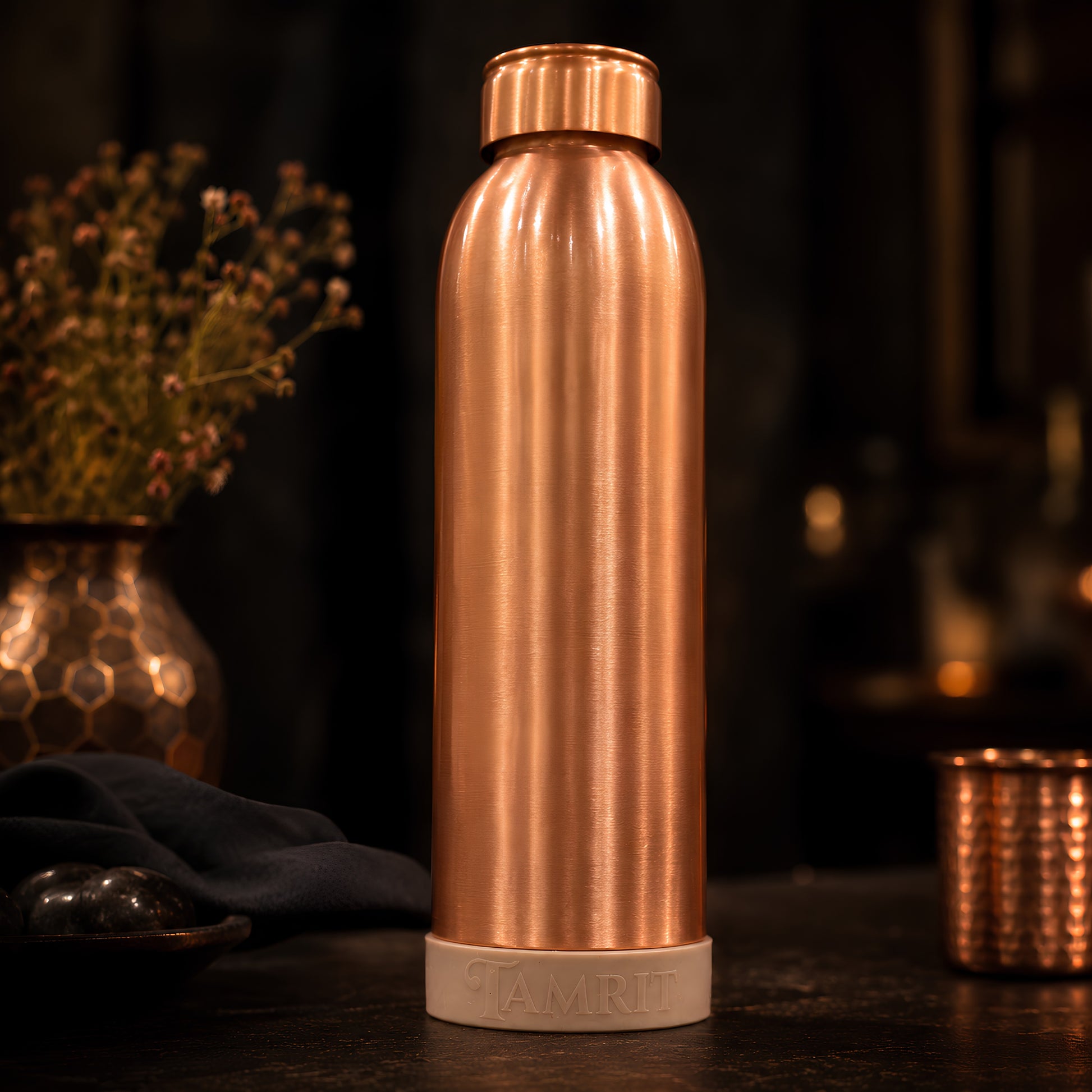 Tamrit copper bottle held to show 1 Litre pure copper matte finish