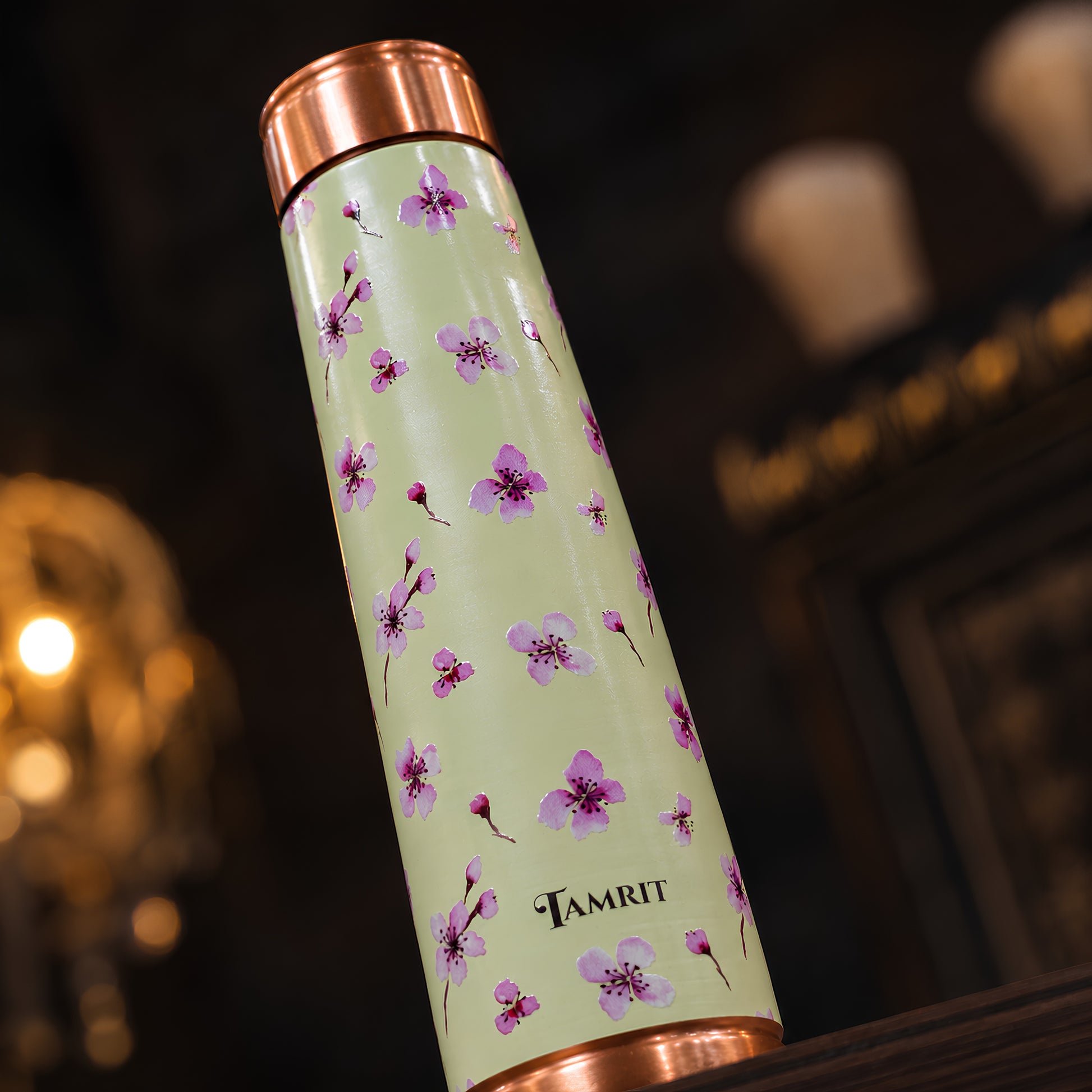 Tamrit Curo copper bottle standing view, white base floral print