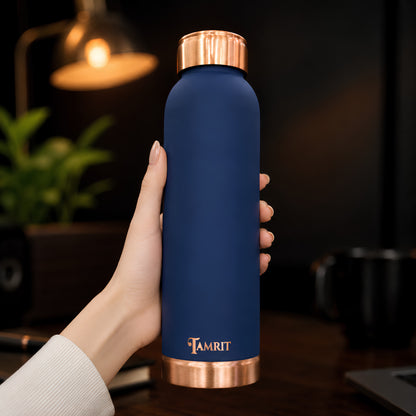 Tamrit blue copper bottle held in hand, showing premium finish
