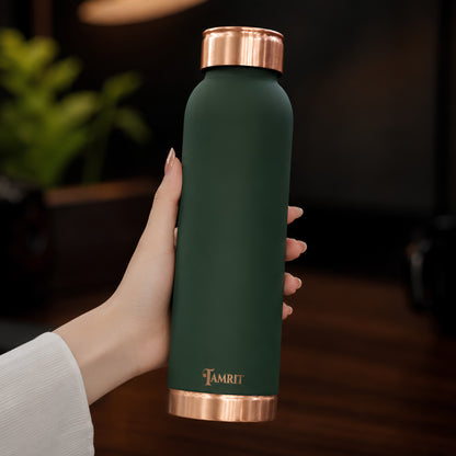 Tamrit green copper bottle held in hand, showing premium finish