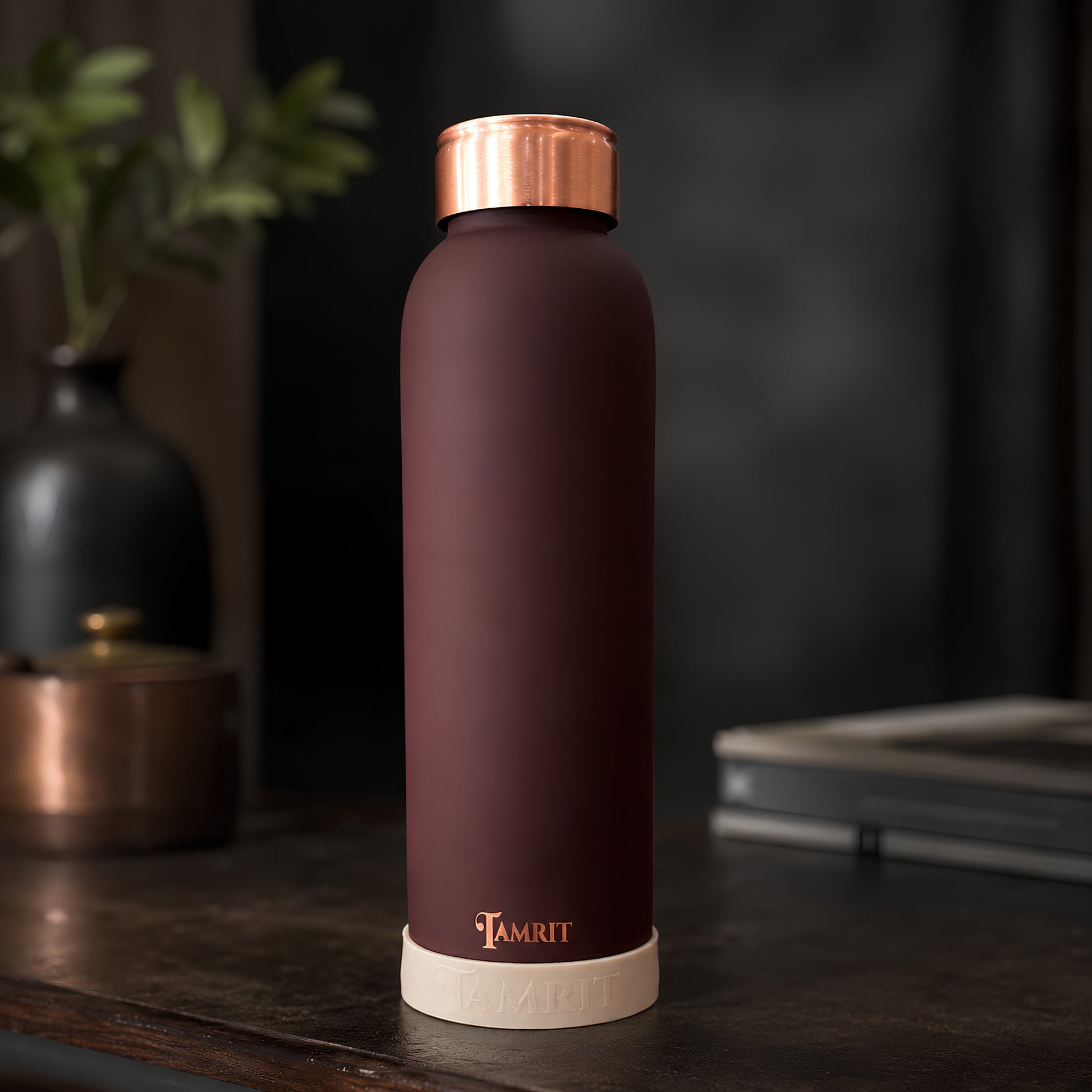 Tamrit CuPro brown copper bottle standing view on wooden table copper bottle protect rubber base