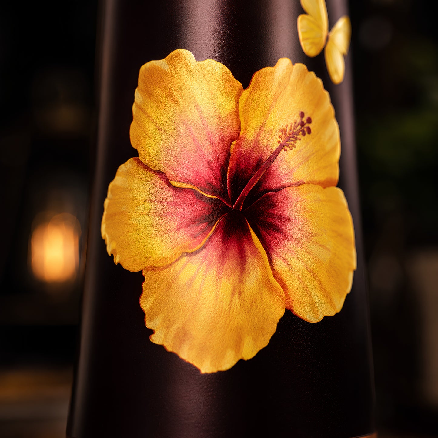 Yellow hibiscus UV embossed design closeup on Tamrit copper bottle