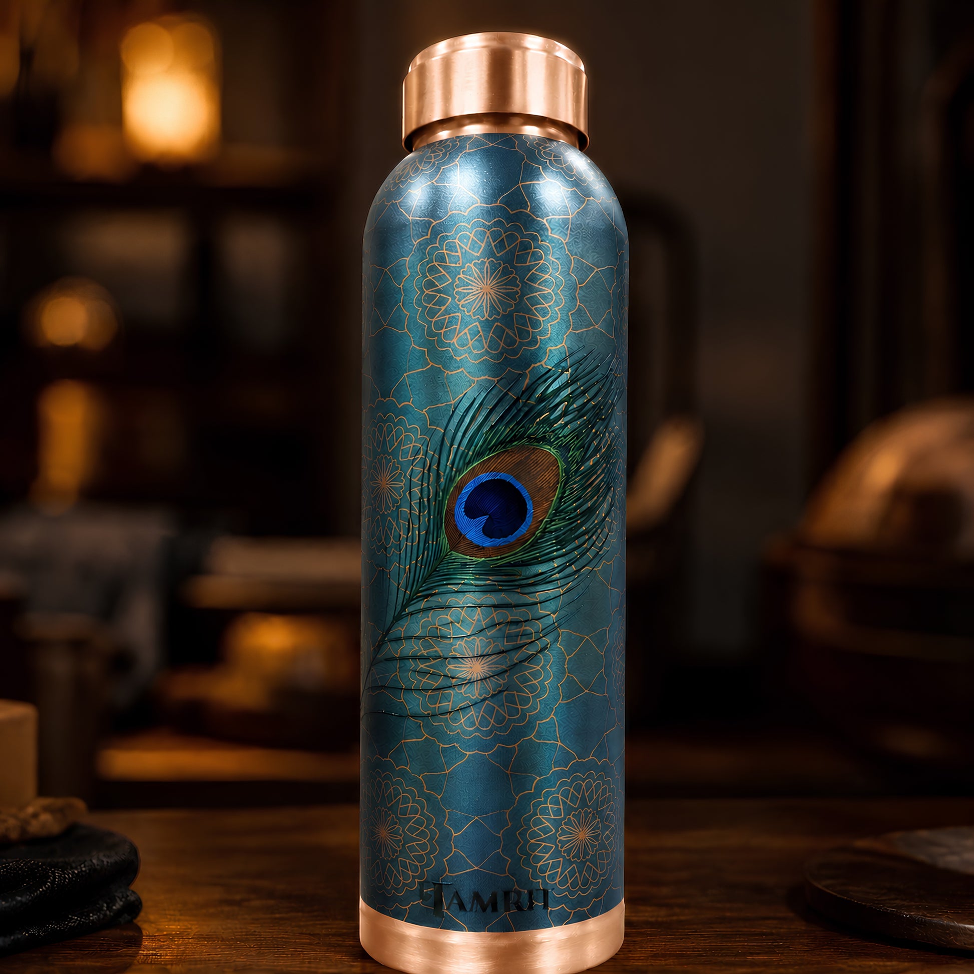 Tamrit CuPro teal copper water bottle with peacock feather design
